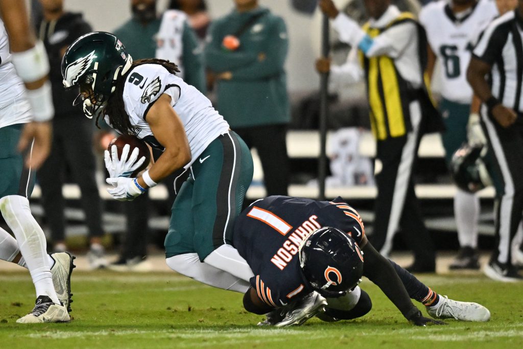 Sep 28, 2026; Chicago, Illinois, USA; Chicago Bears defensive back Jaylon Johnson (1) tackles Philadelphia Eagles wide receiver Makai Lemon (9) during the second half at Soldier Field.