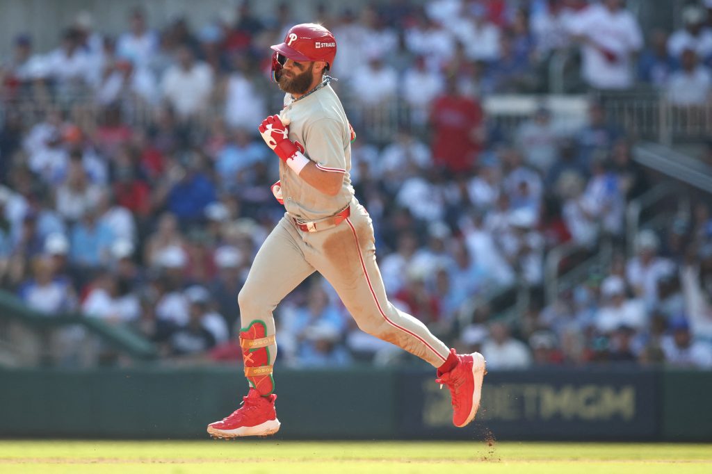 Sep 30, 2026; Cumberland, Georgia, USA; Philadelphia Phillies outfielder Bryce Harper (3) rounds the bases after hitting a solo home run against the Atlanta Braves in the eighth inning during game two of the Wildcard round for the 2026 MLB Playoffs at Truist Park.