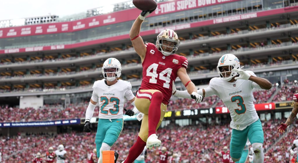 Sep 20, 2026; Santa Clara, California, USA; San Francisco 49ers fullback Kyle Juszczyk (44) scores a touchdown against Miami Dolphins cornerback Chris Johnson (3) during the third quarter against the Miami Dolphins at Levi's Stadium.