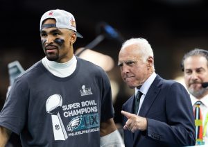 Feb 9, 2025; New Orleans, LA, USA; Philadelphia Eagles quarterback Jalen Hurts (left) celebrates with owner Jeffrey Lurie after defeating the Kansas City Chiefs to win Super Bowl LIX at Ceasars Superdome.