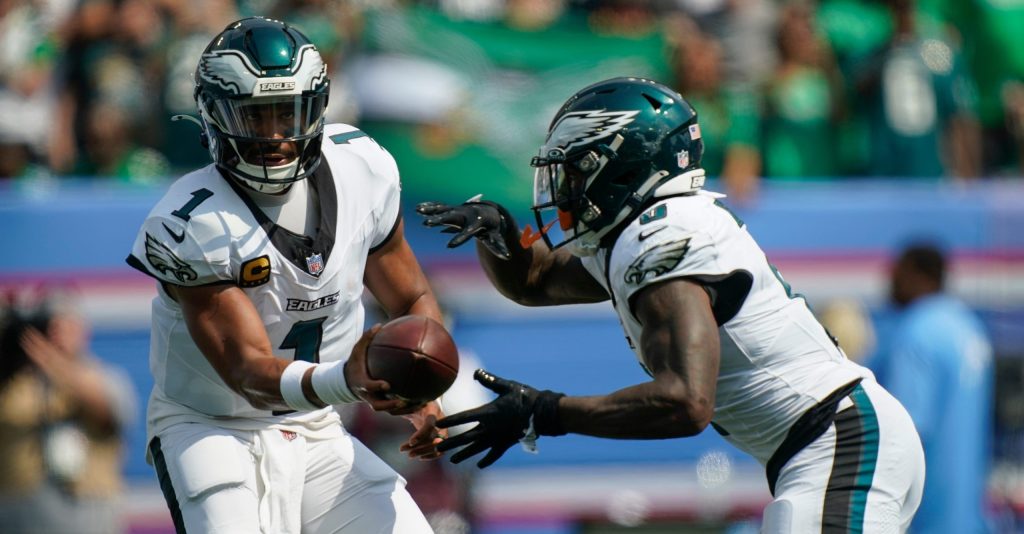 Philadelphia Eagles quarterback Jalen Hurts (1) hands off to running back Tank Bigsby (8) for a touchdown during the second quarter against the Tennessee Titans at Nissan Stadium in Nashville, Tenn., Sunday, Sept. 20, 2026.