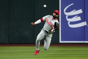 Sep 1, 2026; Phoenix, Arizona, USA; Philadelphia Phillies center fielder Derek Hill (49) makes the running catch against the Arizona Diamondbacks in the fourth inning at Chase Field.