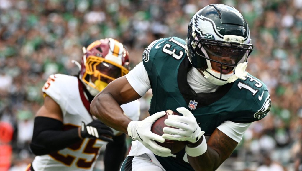 Sep 13, 2026; Philadelphia, Pennsylvania, USA; Philadelphia Eagles wide receiver Dontayvion Wicks (13) catches a pass against Washington Commanders safety Nick Cross (25) during the first half at Lincoln Financial Field.