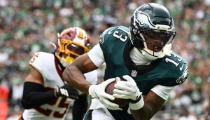 Sep 13, 2026; Philadelphia, Pennsylvania, USA; Philadelphia Eagles wide receiver Dontayvion Wicks (13) catches a pass against Washington Commanders safety Nick Cross (25) during the first half at Lincoln Financial Field.