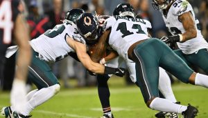 Sep 28, 2026; Chicago, Illinois, USA; Philadelphia Eagles defensive back Cooper DeJean (33) and linebacker Jihaad Campbell (11) tackle Chicago Bears wide receiver Kalif Raymond (14) during the first half at Soldier Field.