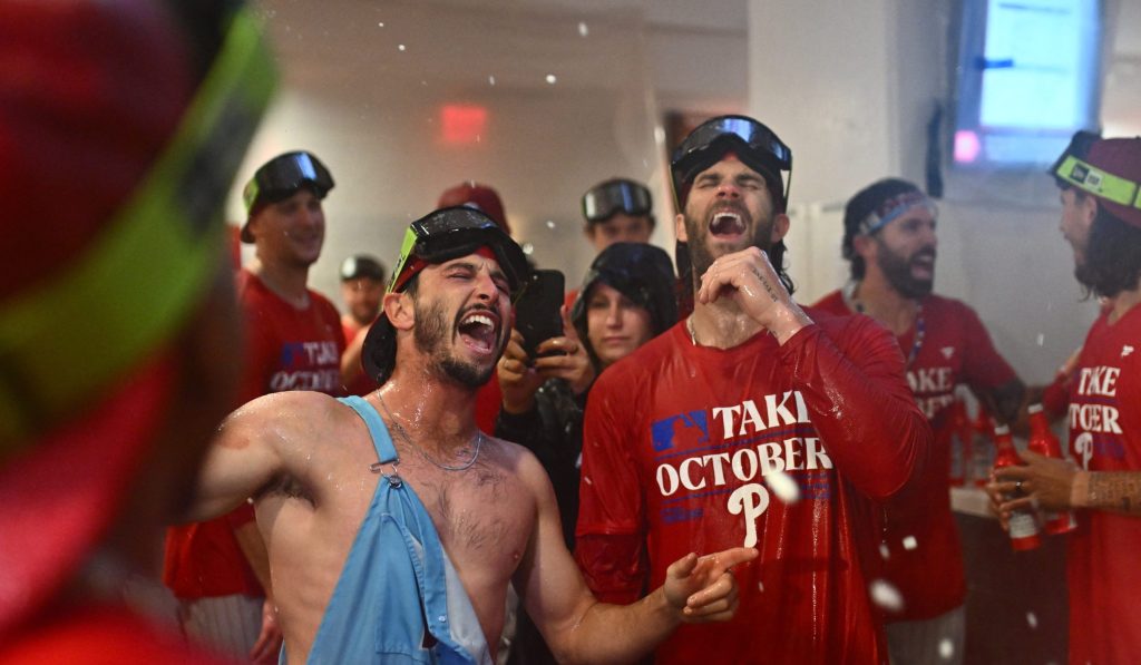Sep 26, 2023; Philadelphia, Pennsylvania, USA; Philadelphia Phillies catcher Garrett Stubbs (21) celebrates with first baseman Bryce Harper (3) after the game against the Pittsburgh Pirates at Citizens Bank Park.