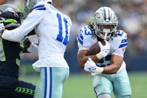 Aug 15, 2026; Seattle, Washington, USA; Dallas Cowboys running back Jaydon Blue (23) carries the ball against the Seattle Seahawks during the game at Lumen Field. Mandatory Credit: