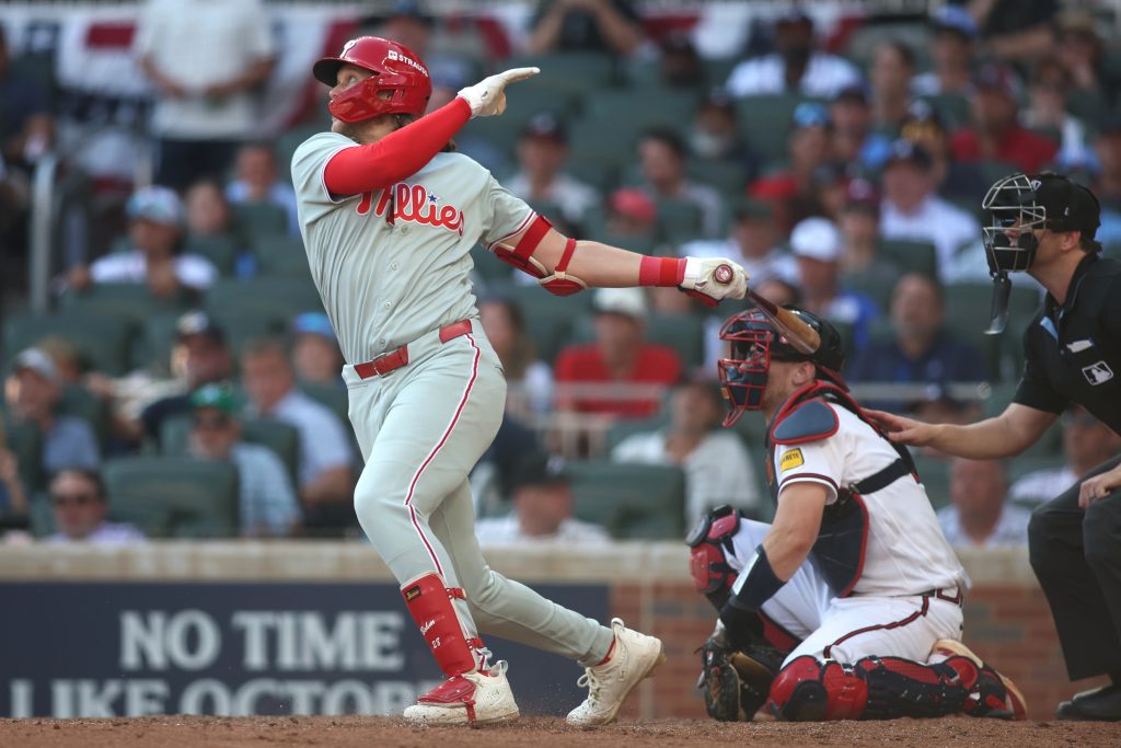 Sep 30, 2026; Cumberland, Georgia, USA; Philadelphia Phillies first baseman Alec Bohm (28) hits a solo home run against the Atlanta Braves in the tenth inning during game two of the Wildcard round for the 2026 MLB Playoffs at Truist Park.