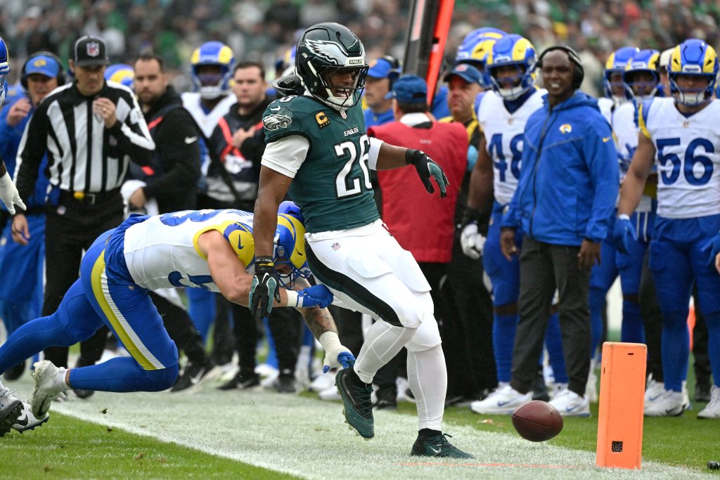 Oct 4, 2026; Philadelphia, Pennsylvania, USA; Philadelphia Eagles running back Saquon Barkley (26) suffers an apparent injury on a tackle by Los Angeles Rams linebacker Nate Landman (53) during the first quarter at Lincoln Financial Field.