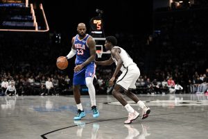 Oct 8, 2026; Brooklyn, New York, USA; Philadelphia 76ers forward Lebron James (23) sets the play while defended by Brooklyn Nets guard Drake Powell (4) during the first half at Barclays Center. Mandatory Credit: John
