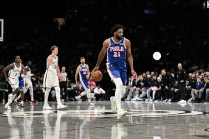 Oct 8, 2026; Brooklyn, New York, USA; Philadelphia 76ers center Joel Embiid (21) leads a fast break against the Brooklyn Nets during the first half at Barclays Center.