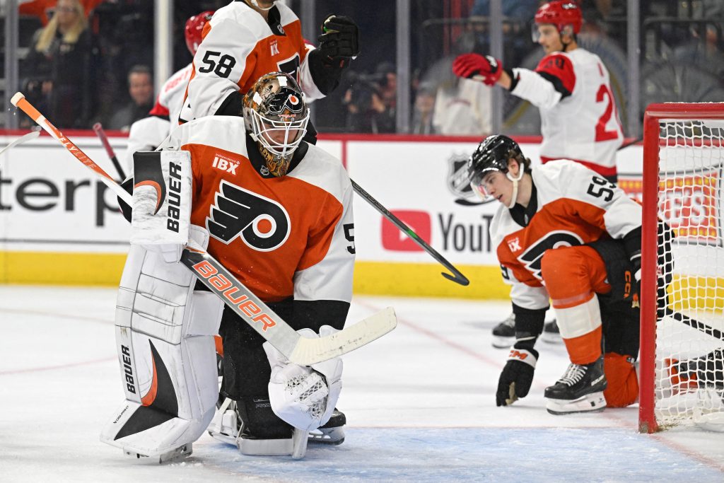 Oct 11, 2026; Philadelphia, Pennsylvania, USA; Philadelphia Flyers goaltender Joseph Woll (53) and defenseman Oliver Bonk (59) react after a Carolina Hurricanes goal during the second period at Xfinity Mobile Arena.