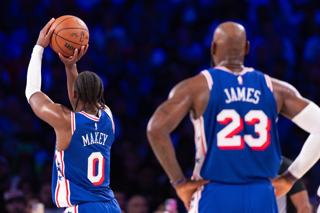 Oct 22, 2026; Philadelphia, Pennsylvania, USA; Philadelphia 76ers guard Tyrese Maxey (0) shoots a foul shot in front of forward LeBron James (23) during the third quarter against the Cleveland Cavaliers at Xfinity Mobile Arena. Mandatory Credit: