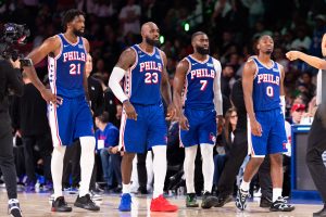 Oct 22, 2026; Philadelphia, Pennsylvania, USA; Philadelphia 76ers Joel Embiid (21) and LeBron James (23) and Jaylen Brown (7) and Tyrese Maxey (0) walk back on the court after a break in action against the Cleveland Cavaliers during the fourth quarter at Xfinity Mobile Arena. Mandatory Credit: