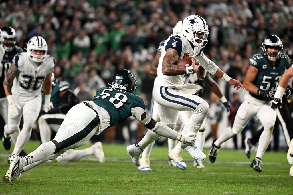 Oct 26, 2026; Philadelphia, Pennsylvania, USA; Dallas Cowboys quarterback Dak Prescott (4) scrambles as Philadelphia Eagles linebacker Jalyx Hunt (58) tackles during the second quarter at Lincoln Financial Field. Mandatory Credit: