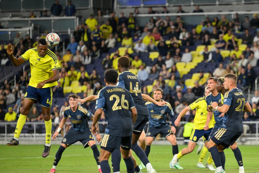 Oct 28, 2026; Nashville, Tennessee, USA; Nashville SC defender Jeisson Palacios (4) heads the ball against the Philadelphia Union during the second half at Geodis Park. Mandatory Credit: