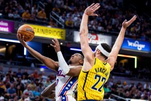 Oct 28, 2026; Indianapolis, Indiana, USA; Philadelphia 76ers guard Tyrese Maxey (0) shoots the ball while Indiana Pacers forward Larry Nance Jr. (22) defends in the second half at Gainbridge Fieldhouse.