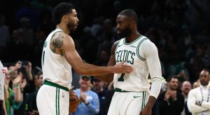 Mar 25, 2026; Boston, Massachusetts, USA; Boston Celtics guard Jaylen Brown (7) and forward Jayson Tatum (0) congratulate each other in the final seconds of the fourth quarter of their win over the Oklahoma City Thunder at TD Garden.