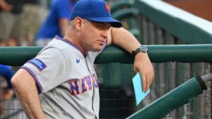 Jun 18, 2026; Philadelphia, Pennsylvania, USA; New York Mets manager Carlos Mendoza (64) in the dugout against the Philadelphia Phillies at Citizens Bank Park.
