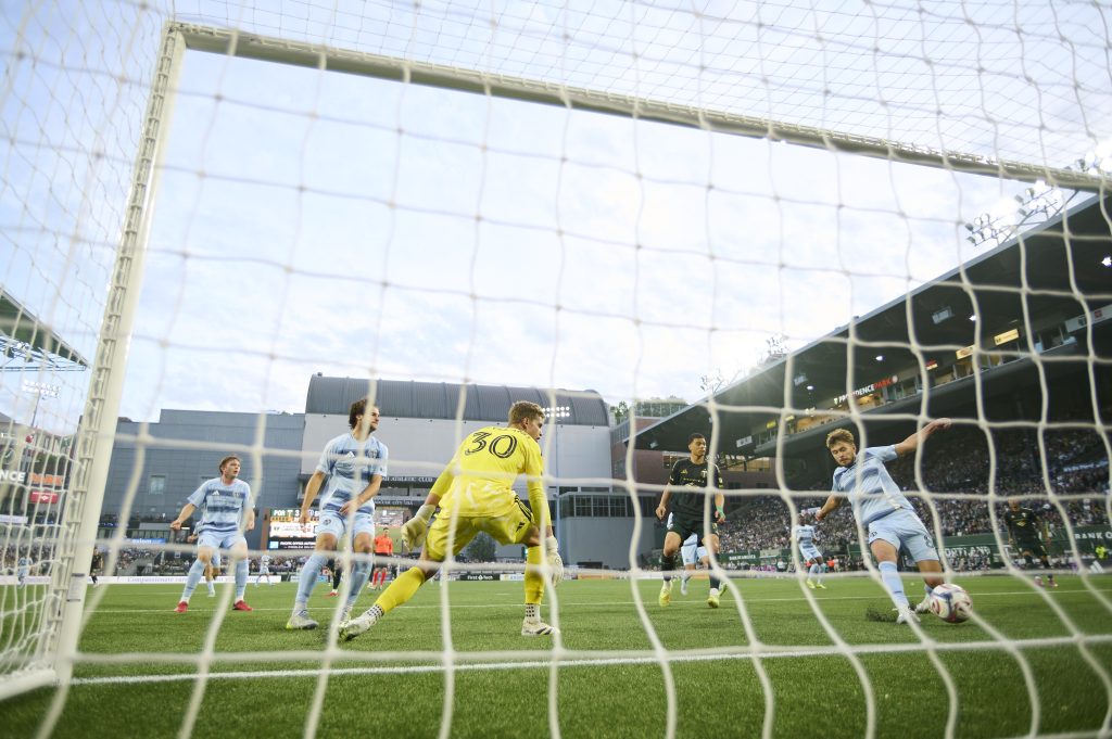 May 9, 2026; Portland, Oregon, USA; Sporting Kansas City midfielder Jacob Davis (8) inadvertently kicks the ball into the net giving the Portland Timbers a goal during the first half at Providence Park.