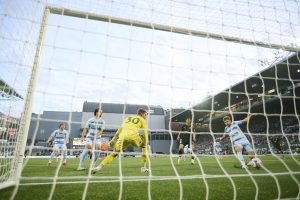 May 9, 2026; Portland, Oregon, USA; Sporting Kansas City midfielder Jacob Davis (8) inadvertently kicks the ball into the net giving the Portland Timbers a goal during the first half at Providence Park.