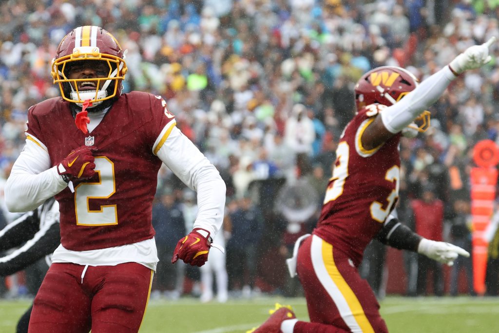 Sep 27, 2026; Landover, Maryland, USA; Washington Commanders cornerback Amik Robertson (2) reacts after a fumble against the Seattle Seahawks in the first half at Northwest Stadium.